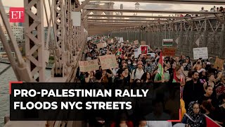 ProPalestine protesters storm Brooklyn Bridge in New York demand Gaza ceasefire [upl. by Norvan768]