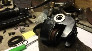 Removing Seized Caliper Piston  Grease Gun Trick [upl. by Atinwahs235]