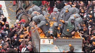 FOOD FIGHT Thousands gather in Ivrea Italy to pummel each other with 11 million pounds of oranges [upl. by Norah]