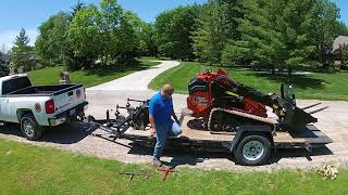 SK1550 Ditch Witch mini skid moving pallet of caps [upl. by Eenaj]