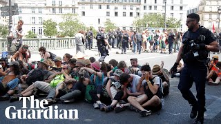 Police use pepper spray on seated climate protesters in Paris [upl. by Beatriz469]