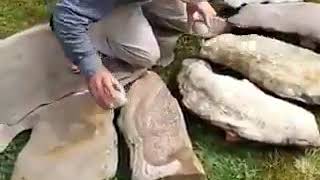 Archaeologist Dr JeanLoup Ringot specialized in prehistoric music demonstrates a Lithophone [upl. by Olifoet740]