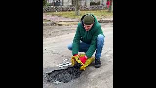 Good Samaritan repairs a pit on the road shorts [upl. by Howlend736]