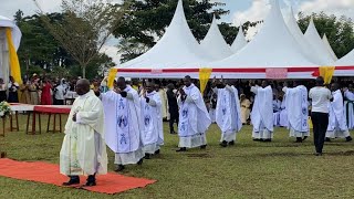 The newly ordained priests wave to the congregation [upl. by Ainniz]