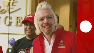 Virgin Group founder Richard Branson works as stewardess for a day [upl. by Gearalt]