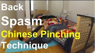 Back Spasm Chinese Pinching Technique How to Video [upl. by Adnilev227]